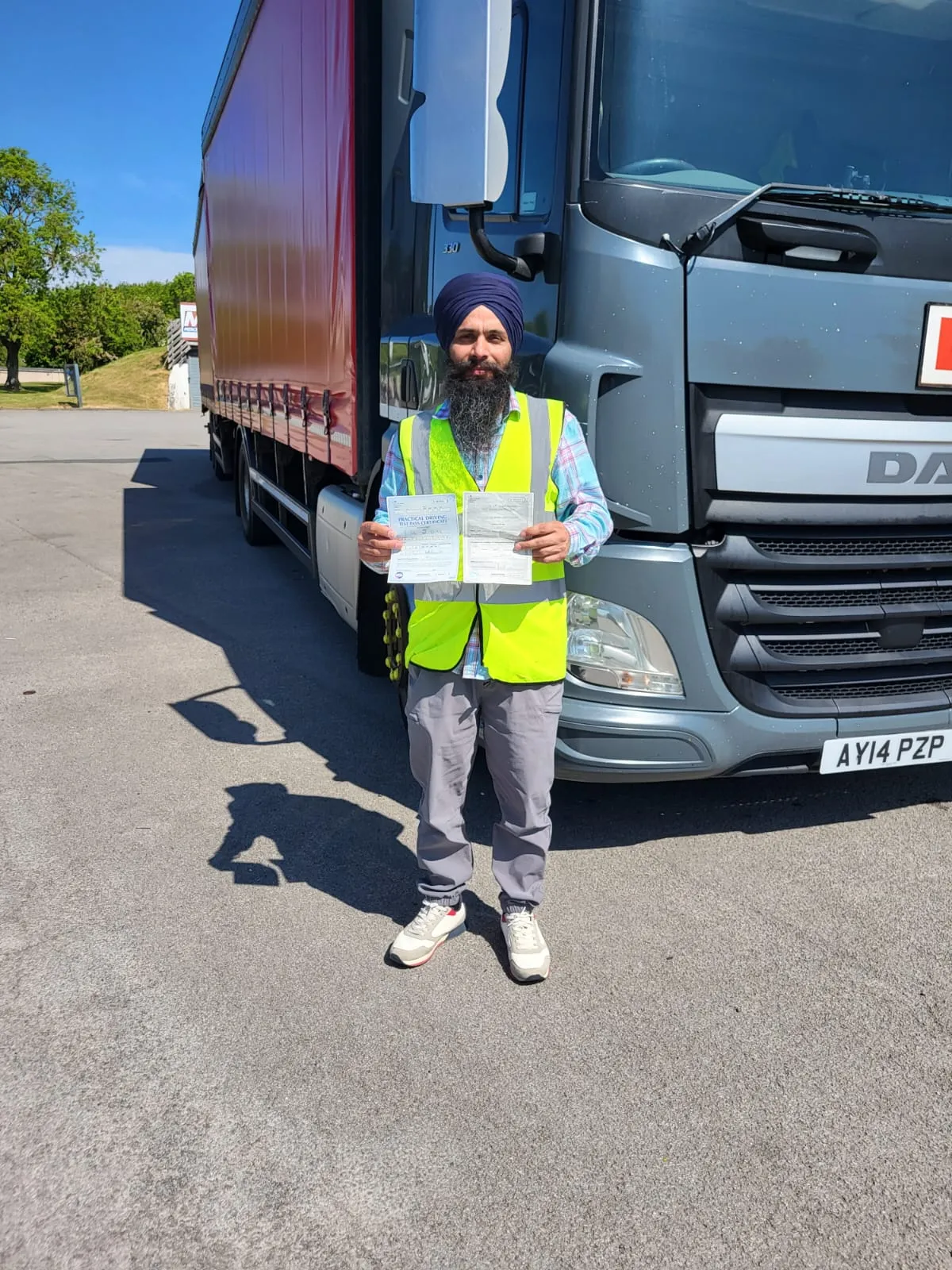 Man in high vis outside lorry